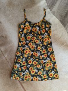 "Elevate your vintage wardrobe with this 90s Cotton Cami Slipdress from Rampage. Featuring a sunflower print, this dress is a perfect addition to your summer wardrobe.  The delicate cami straps add a touch of femininity while the slinky silhouette and lightweight fabric make it comfortable to wear all summer long. Does not have much stretch, so please check measurements! Made in the USA. This sundress is a true gem and a must-have for any vintage lover 🌻 100% Cotton Measurements taken flat PTP Yellow Sundress With Sunflower Print For Summer, Casual Yellow Sunflower Print Dress, Vintage Printed Summer Mini Dress, Fitted Summer Dress With Sunflower Print, Sleeveless Sundress With Sunflower Print For Spring, Yellow Sleeveless Sundress With Sunflower Print, Casual Sunflower Print Beach Dress, Casual Fitted Sunflower Print Dress, Summer Cotton Dress With Sunflower Print