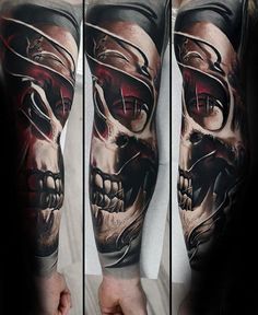 a man's arm with a skull tattoo on it