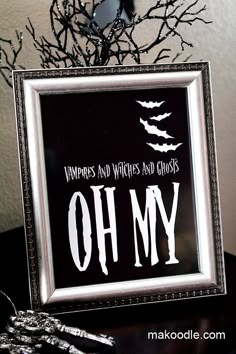 a framed sign that says, vampires and witches and ghost's oh my