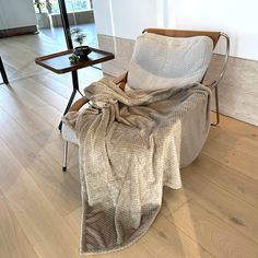 a chair with a blanket draped over it