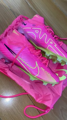 pink and green nike shoes in a shoe bag