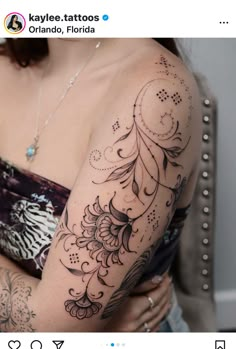 a woman with a tattoo on her arm