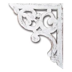 an old white metal shelf bracket on a white background with the letter s in the center