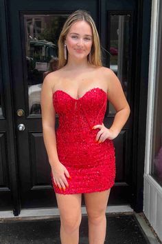 Shine brightly at your homecoming event in this eye-catching strapless red dress. The sheath silhouette is adorned with dazzling sequins that catch the light from every angle. With a short length perfect for dancing, the sleeveless design ensures comfort and freedom of movement. The lace-up back provides an adjustable fit, and intricate appliqués and lace add an extra touch of elegance to this dress. Detail: Silhouette: Sheath Style Fabric: Sequin Fabric Color: Red Color Length: Short Length Nec Short Cute Dresses, Strapless Red Dress, Ruffles Potato Chips, Fall Ball, Red Strapless Dress, Sequin Short, Mini Party Dress, Red Homecoming Dresses, Junior Prom