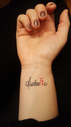 a woman's arm with a tattoo on it that reads diaba inc and the word diaba inc in cursive font