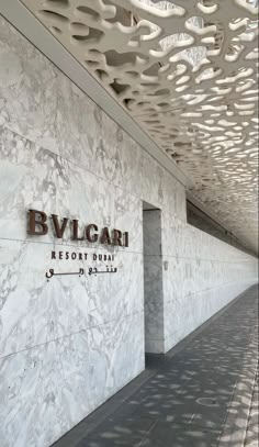 the entrance to bvlgari resort duma is lined with white marble