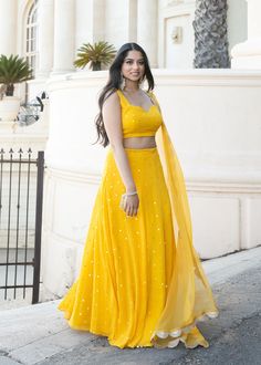 This showstopper mango yellow, Devi, is a must have for your mehendi/haldi ceremony! This colorful and playful mirror lehenga is the perfect party piece. Blouse, skirt, and dupatta included. Haldi Ceremony Outfit Simple, Haldi Ceremony Outfit For Bride, Yellow Lehenga For Haldi, Dress For Haldi Function, Haldi Dress Ideas, Mirror Lehenga, Mayon Dresses, Haldi Ceremony Outfit, Haldi Dress