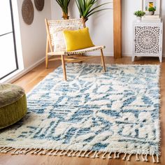 a white and blue rug in a living room