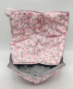 the inside of a purse with pink flowers on it