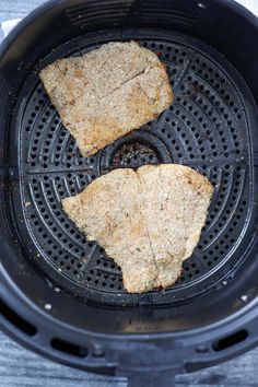 two pieces of food cooking in an air fryer