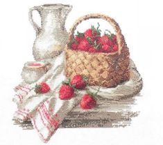 a basket of strawberries next to a white pitcher