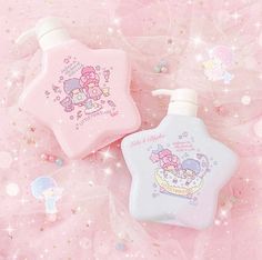 two pink and white star shaped soap bottles with cartoon characters on them, sitting on a pink background