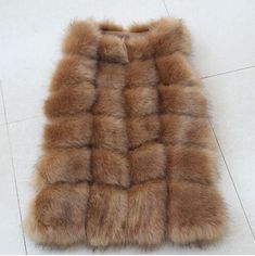 The faux fox fur waistcoat has an eye-popping hue that proffers an amazing look this winter. This sleeveless coat is sure to make heads turn, owing to its fabulous design. Crafted in great quality material, this O-necked coat is fashioned for plus sized women. Its covered button closure adds class to this casual coat, ensuring you get noticed. Available at a fair cost, it is surely worth purchasing. Order today! Specifications Gender: WomenOuterwear Type: Fur & Faux FurType: Sleeveless VestC Fur Bags, Fur Vest Women, Waistcoat Fashion, Fur Waistcoat, Long Fur Coat, Fox Fur Vest, Sleeveless Coat, Coat Women Fashion, Fur Clothing