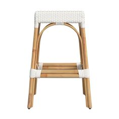 a white wicker stool with straps on the back and seat, against a white background