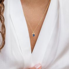 The Sapphire Teardrop Necklace is a beautiful choice for those looking for a timeless and meaningful accessory or a thoughtful gift for someone special. This particular necklace showcases a teardrop-shaped pendant adorned with a sapphire gemstone. Sapphire is the birthstone for the month of September, making it a meaningful gift for those born in that month or anyone who appreciates the beauty of sapphire. Material: High Quality Solid 925 Sterling Silver Finish: Sterling Silver ∙ 18K Gold Featur Sapphire Pendant Birthstone Necklace For Gift, Sapphire Teardrop Pendant Necklace, Gold Teardrop Sapphire Necklace, Sapphire Drop Necklaces For Gifts, Sapphire Drop Necklace For Gift, Sapphire Teardrop Pendant Jewelry, Delicate Teardrop Birthstone Necklace Gift, Blue Pear-shaped Drop Necklace For Gift, Sapphire Teardrop Pendant Birthstone Necklace