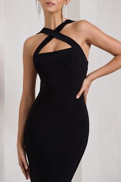 Carefully cut in a premium stretch jersey that clings to each curve. this black maxi dress is as flattering as it is flawless. Detailed by delicately criss-crossing straps. Cross My Heart is the epitome of understated glamour. For the perfect wedding guest look. try complimenting this halter-neck dress with a sleek bun and gold accents. Features - Premium stretch jersey- Crossed halter neckline- Sleeveless- Bum ruching- Maxi length Sizing & Fit Model is 5'7" and wears UK size 8 / US size 4 Product Information Designed exclusively by Club L London Double layered with good stretch Premium jersey in Black (95% Polyester. 5% Elastane) 155cm total length SKU: CL130020002