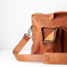 Equz messenger bag in tan leather by Capra Leather • Unique product design • Messenger bag with a tan leather color • Men's bag collection • Functional and stylish design. · Men's accessories, · men's daily fashion · men's bags • fashion editorial • Art direction •#productdesign #bags #techbag #craftsmanship #leatherwork #mensaccessories #mensfashion #mensclassystyle #mensbag #mensgift Leather Messenger Bag Laptop, Tech Essentials, Mens Bags Fashion, Tech Bag, Large Luggage, Editorial Art, Unique Products Design, Laptop Messenger Bags, Luggage Strap