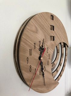 a clock that is on the side of a wall with roman numerals and numbers