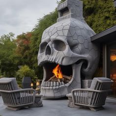 an outdoor fireplace with chairs around it and a skull head on the top of it