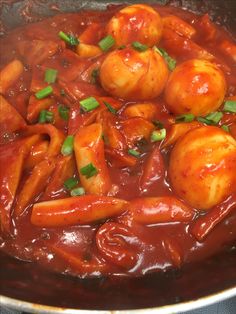 some food is being cooked in a pan on the stove top and ready to be eaten