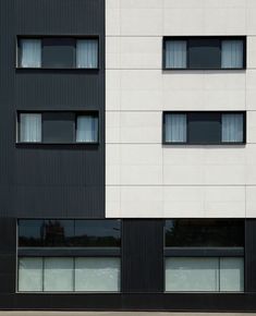 two black and white buildings side by side