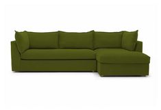 a large green couch with pillows on it's back and the seat folded out