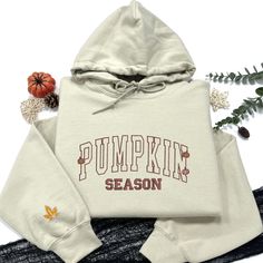 autumn sweatshirt, cute fall gift, fall gifts, halloween sweaters, hello pumpkin season, pumpkin season gift, pumpkin spice, retro halloween, spooky season, thanksgiving gift, thanksgiving shirt, sweater for women, cute fall sweatshirt 🍁PRODUCT AND BRAND DETAILS - Gildan ® brand - Unisex & Classic fit - 8 oz./yd² (US) 13.3 oz./L yd (CA), 50/50 - Heather Sport colors are 60/40 polyester/cotton - Our top-selling shirt colors consist of Sand, Black, White, Sport Gray, Dark Chocolate, Forest Green, Retro Hooded Sweatshirt For Fall, Retro Hoodie With Letter Print For Fall, Fall Hooded Sweatshirt With Letter Embroidery, Hooded Fall Sweatshirt With Letter Embroidery, Hooded Sweatshirt With Letter Embroidery For Fall, Fall Cotton Hoodie With Letter Embroidery, Retro Crew Neck Hoodie For Fall, Retro Fall Hoodie For College, Retro Fall College Hoodie