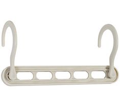 a white shelf with two hooks on it