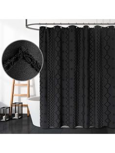 a black shower curtain hanging on the side of a white wall next to a chair