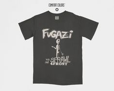 Raw energy post-hardcore Comfort Colors® 1717 vintage style Fugazi t-shirt. Featuring a design inspired by the iconic rock band, this streetwear summer shirt is perfect for fans of Fugazi, Alternative Rock, and Rock Music. Whether you're hitting a music festival or enjoying a casual day out, this tee lets you showcase your passion for the genre. As a retro band shirt, it captures the spirit of Fugazi's unforgettable sound and influence. A vintage band tee that's a versatile addition to any wardr Grunge Streetwear Shirt With Front Print, Alternative Pre-shrunk Streetwear Shirt, Grunge Style Shirt With Front Print For Streetwear, Grunge Front Print Shirt For Streetwear, Pre-shrunk Alternative Streetwear Shirt, Alternative Style Summer Shirt With Screen Print, Alternative Style Screen Print Summer Shirt, Summer Streetwear Shirt With Band Logo, Casual Shirt With Band Logo For Streetwear