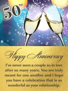 two glasses of champagne with the words happy anniversary