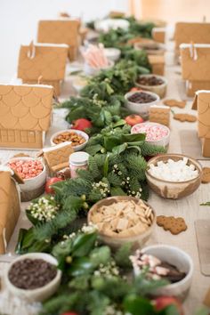 the table is set up with many different foods and desserts on top of it