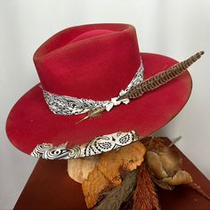 *PRICE INCLUDES $15 HAT BOX* Premium Wool Felt 4 1/4 Crown, 3 3/4 inch brim Custom Color, Distressing, Band and Accessories Dri-lex sweatband for added comfort Colors may vary slightly. Although each hat is unique a similar hat can be made in various sizes. All Sales Final Red Western Fedora With Short Brim, Red Fedora With Curved Brim For Rodeo, Western Style Red Fedora With Short Brim, Red Curved Brim Fedora For Rodeo, Red Western Hat With Short Brim, Red Curved Brim Hat For Rodeo, Red Fedora With Curved Brim For Country Events, Red Wide Brim Felt Hat For Country Events, Classic Curved Brim Hat As A Gift