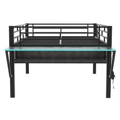 a black metal bench with glass top