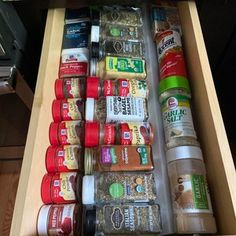 an open drawer filled with spices and condiments