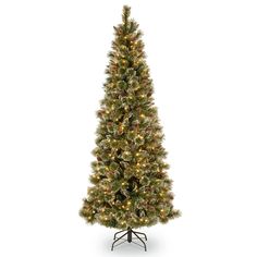 a white christmas tree with lights on it's base and a black metal stand