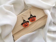 ➙Embrace the enchantment of Halloween with these handcrafted pumpkin earrings! Each meticulously designed and handcrafted pair captures the essence of the season, making them the perfect choice for Halloween parties, costume events, or simply immersing yourself in the spirit of the season.♥︎ ➙Key Features: - Handcrafted with precision using high-quality Miyuki beads. - Unique pumpkin designs that exude Halloween vibes. - Lightweight and comfortable for all-day wear. - Versatile, suitable for bot Brick Stitch Halloween Patterns, Halloween Beaded Earrings Patterns Free, Pumpkin Beaded Earrings, Fall Beaded Earrings, Halloween Beaded Earrings, Halloween Beaded Jewelry, Fall Bead, Pumpkin Designs, Earrings Charms