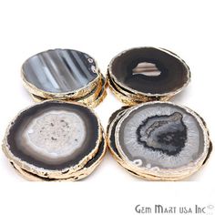 four agate stone coasters sitting on top of each other