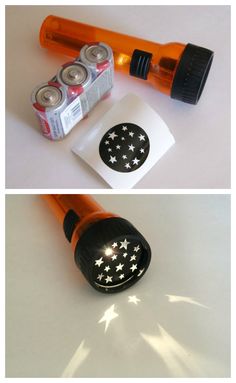 an orange flashlight and some batteries on top of a white table with the same light