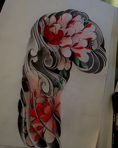 an artistically designed piece of art with flowers and swirls on the back of it