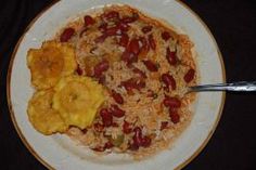 a white plate topped with rice and beans