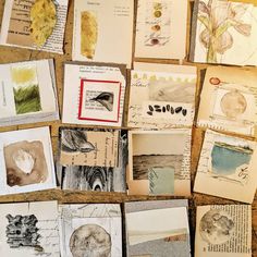 many different types of paper and pictures on a table