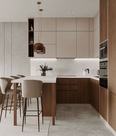 a kitchen filled with lots of counter top space next to a dining room table and chairs