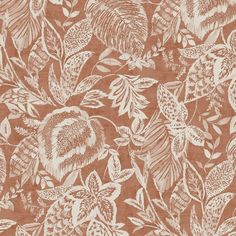 an orange and white floral print fabric with lots of leaves on the top of it