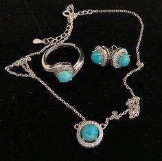 Add a touch of elegance, colour and sparkle to any outfit with this classic yet vibrant natural turquoise jewellery set. The 6mm blue turquoise cabochon-cut stones are beautifully contrasted with sparkling cubic zirconia and solid sterling silver plated with 14k white gold.  Sterling (.925) silver is a durable, versatile precious metal that when taken care of, can retain its brilliant, white shine and last a lifetime. How to care for your jewellery: Make sure these pieces are the last thing you put on and the first thing you take off. Always put your jewellery on after you apply any make-up, hair products or perfume to keep it looking its best for years to come. Elegant Turquoise Round Jewelry Sets, Turquoise Jewelry Sets As A Gift, Turquoise Sterling Silver Jewelry For Party, Turquoise Gemstone Jewelry For Party, Elegant Turquoise Necklace With Matching Earrings, Elegant Turquoise Necklace And Earrings Set, Elegant Turquoise Jewelry Set For Party, Formal Turquoise Jewelry With Matching Earrings, Turquoise Round Jewelry For Formal Occasions