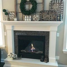 a fireplace with a wreath on top of it