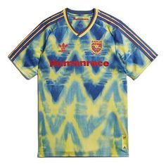 a blue and yellow tie - dye shirt with the words human race on it, in red