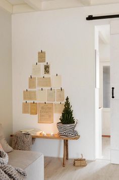 a living room with a christmas tree on the wall