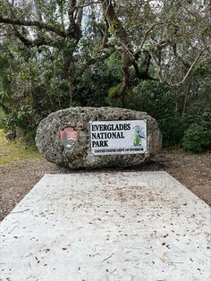 the entrance sign to evergladess national park is displayed in front of some trees