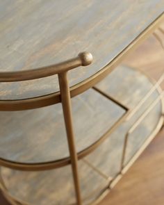 a close up of a table with a wooden top and metal frame around the edge